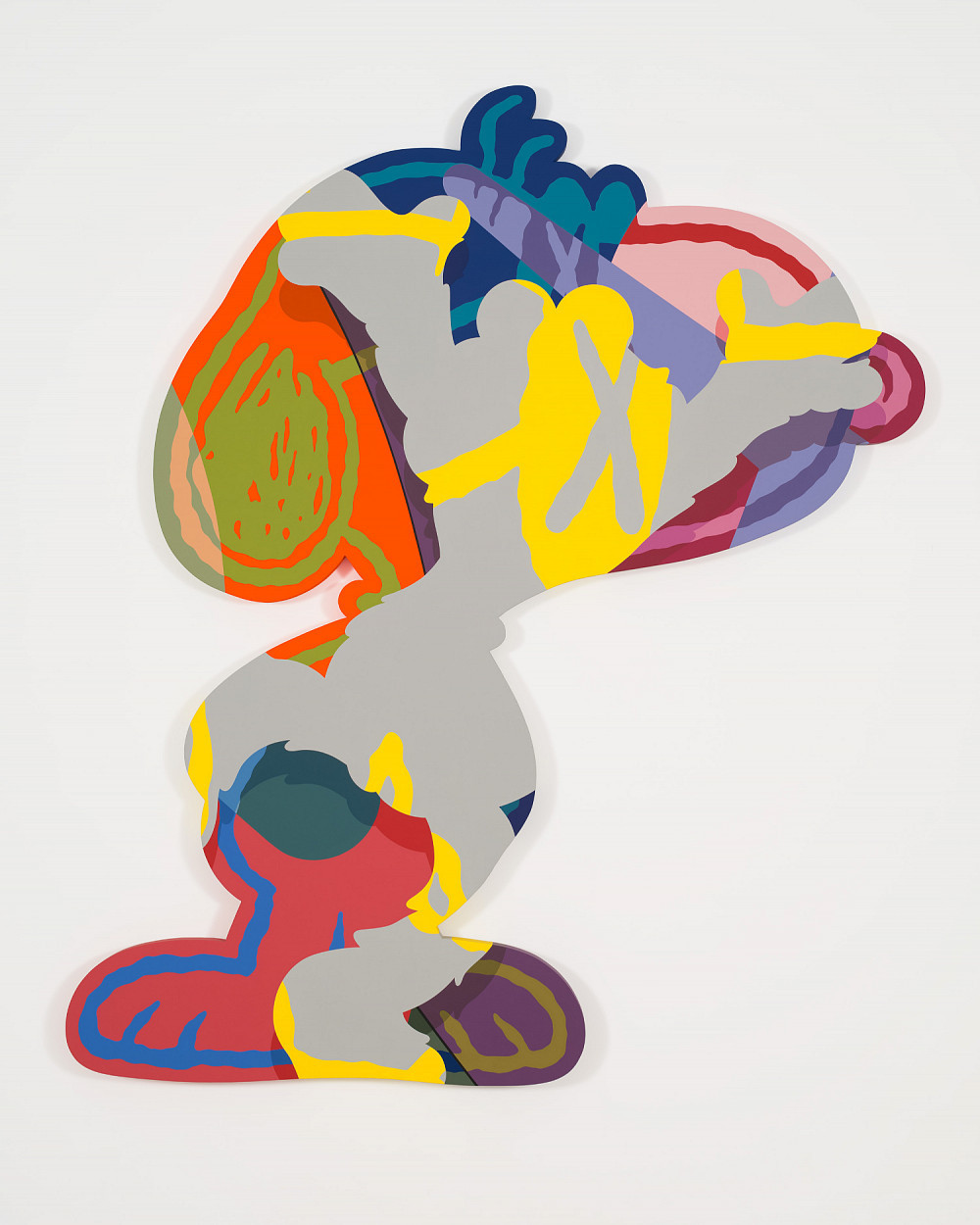 Snoopy figure painted with bright colors and patterns.