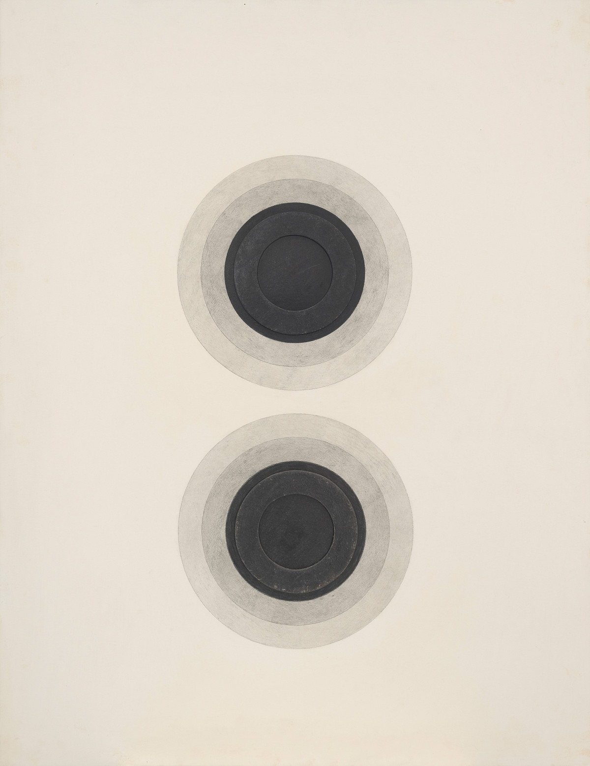 Two round objects – resembling loudspeakers – drawn one below the other. Each object has a dark circle in the centre, and the circles become progressively lighter towards the outside.
